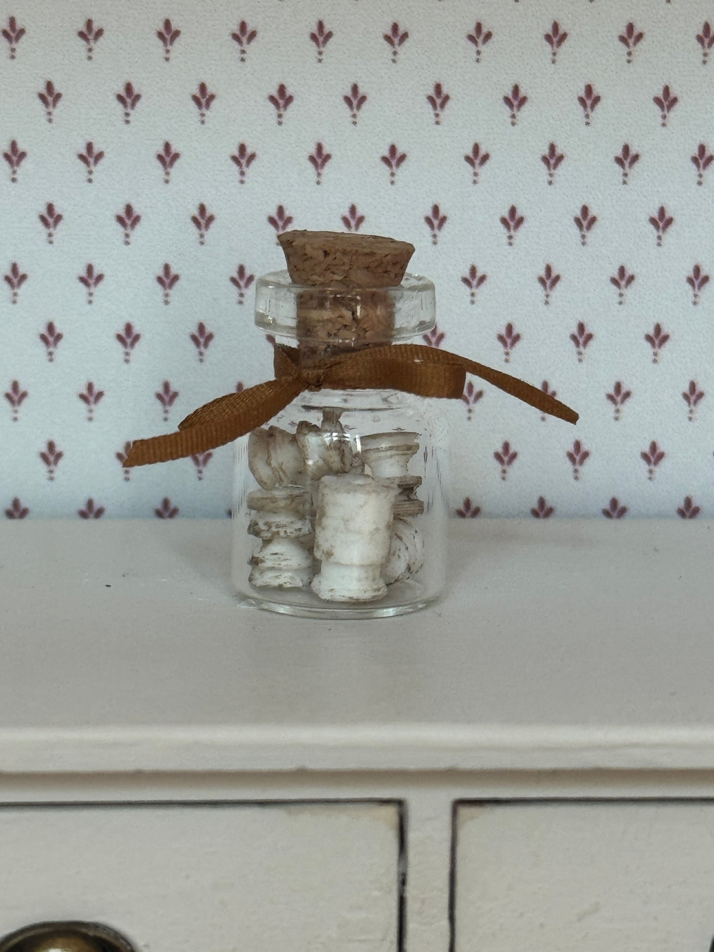 Jar of Tiny White Insulators